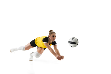 Image showing Young female volleyball player isolated on white studio background. Woman in sport\'s equipment training and practicing.