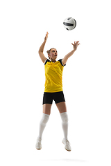 Image showing Young female volleyball player isolated on white studio background. Woman in sport\'s equipment training and practicing.