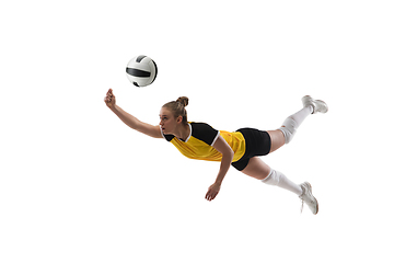 Image showing Young female volleyball player isolated on white studio background. Woman in sport\'s equipment training and practicing.