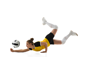 Image showing Young female volleyball player isolated on white studio background. Woman in sport\'s equipment training and practicing.