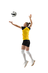 Image showing Young female volleyball player isolated on white studio background. Woman in sport\'s equipment training and practicing.