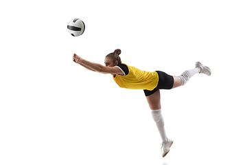 Image showing Young female volleyball player isolated on white studio background. Woman in sport\'s equipment training and practicing.