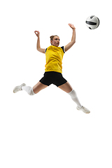 Image showing Young female volleyball player isolated on white studio background. Woman in sport\'s equipment training and practicing.