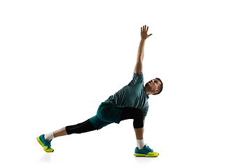 Image showing Young caucasian male model in action, motion isolated on white background. Concept of sport, movement, energy and dynamic, healthy lifestyle. Training, practicing.