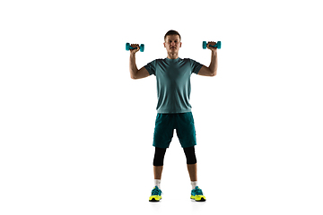 Image showing Young caucasian male model in action, motion isolated on white background. Concept of sport, movement, energy and dynamic, healthy lifestyle. Training, practicing.