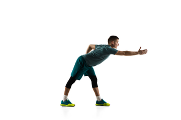 Image showing Young caucasian male model in action, motion isolated on white background. Concept of sport, movement, energy and dynamic, healthy lifestyle. Training, practicing.