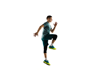 Image showing Young caucasian male model in action, motion isolated on white background. Concept of sport, movement, energy and dynamic, healthy lifestyle. Training, practicing.