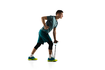 Image showing Young caucasian male model in action, motion isolated on white background. Concept of sport, movement, energy and dynamic, healthy lifestyle. Training, practicing.