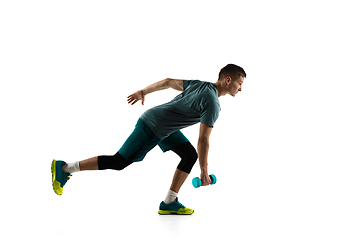 Image showing Young caucasian male model in action, motion isolated on white background. Concept of sport, movement, energy and dynamic, healthy lifestyle. Training, practicing.