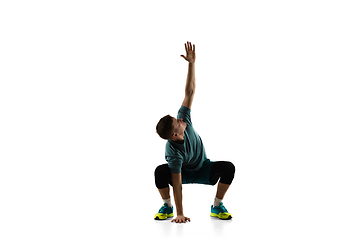 Image showing Young caucasian male model in action, motion isolated on white background. Concept of sport, movement, energy and dynamic, healthy lifestyle. Training, practicing.