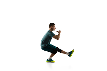 Image showing Young caucasian male model in action, motion isolated on white background. Concept of sport, movement, energy and dynamic, healthy lifestyle. Training, practicing.