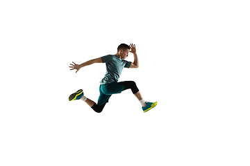 Image showing Young caucasian male model in action, motion isolated on white background. Concept of sport, movement, energy and dynamic, healthy lifestyle. Training, practicing.