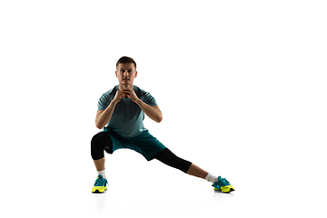 Image showing Young caucasian male model in action, motion isolated on white background. Concept of sport, movement, energy and dynamic, healthy lifestyle. Training, practicing.