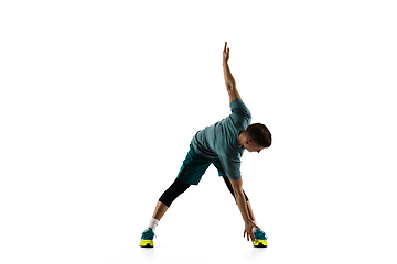 Image showing Young caucasian male model in action, motion isolated on white background. Concept of sport, movement, energy and dynamic, healthy lifestyle. Training, practicing.