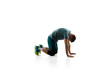 Image showing Young caucasian male model in action, motion isolated on white background. Concept of sport, movement, energy and dynamic, healthy lifestyle. Training, practicing.