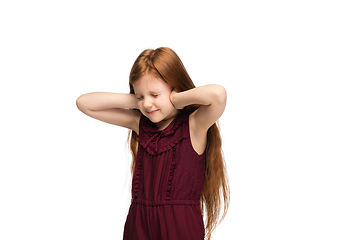 Image showing Happy caucasian little girl isolated on white studio background. Looks happy, cheerful, sincere. Copyspace. Childhood, education, emotions concept