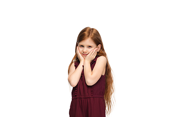 Image showing Happy caucasian little girl isolated on white studio background. Looks happy, cheerful, sincere. Copyspace. Childhood, education, emotions concept