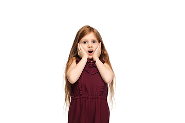 Image showing Happy caucasian little girl isolated on white studio background. Looks happy, cheerful, sincere. Copyspace. Childhood, education, emotions concept