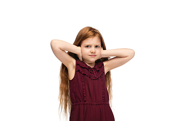 Image showing Happy caucasian little girl isolated on white studio background. Looks happy, cheerful, sincere. Copyspace. Childhood, education, emotions concept