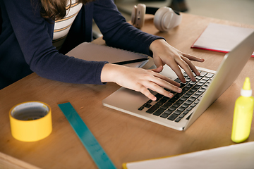 Image showing Close up hands of girl typing during group video call, use video conference with teacher, listening to online course