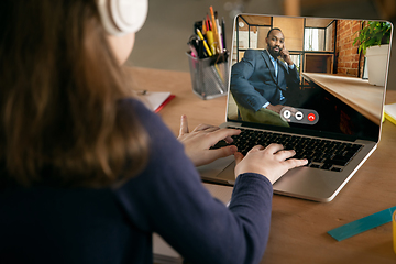 Image showing Little girl studying by group video call, use video conference with teacher, listening to online course