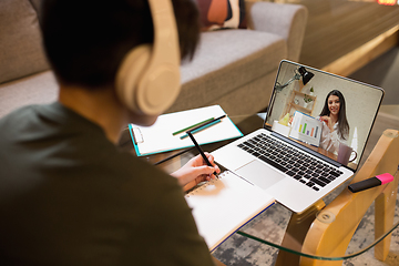 Image showing Little boy studying by group video call, use video conference with teacher, listening to online course