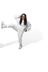 Image showing High angle view of young woman on white studio background. Girl in motion or movement. Human emotions and facial expressions concept