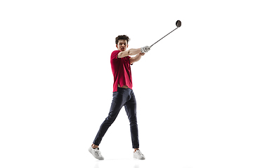 Image showing Golf player in a red shirt taking a swing isolated on white studio background