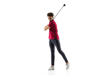 Image showing Golf player in a red shirt taking a swing isolated on white studio background