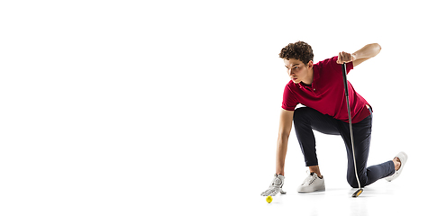 Image showing Golf player in a red shirt training, practicing isolated on white studio background