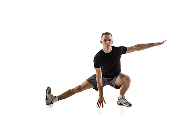 Image showing Young caucasian male model in action, motion isolated on white background. Concept of sport, movement, energy and dynamic, healthy lifestyle. Training, practicing.