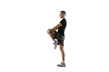 Image showing Young caucasian male model in action, motion isolated on white background. Concept of sport, movement, energy and dynamic, healthy lifestyle. Training, practicing.