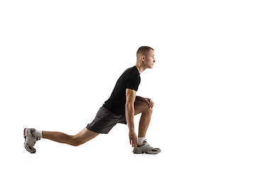 Image showing Young caucasian male model in action, motion isolated on white background. Concept of sport, movement, energy and dynamic, healthy lifestyle. Training, practicing.