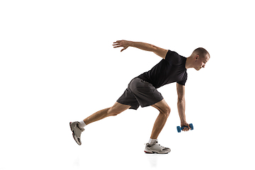 Image showing Young caucasian male model in action, motion isolated on white background. Concept of sport, movement, energy and dynamic, healthy lifestyle. Training, practicing.