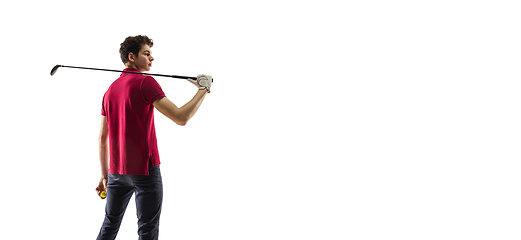 Image showing Golf player in a red shirt training, practicing isolated on white studio background