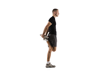 Image showing Young caucasian male model in action, motion isolated on white background. Concept of sport, movement, energy and dynamic, healthy lifestyle. Training, practicing.