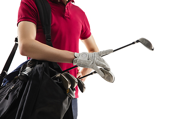 Image showing Golf player in a red shirt training, practicing isolated on white studio background