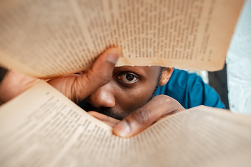 Image showing African-american man looking for job in unusual places at his home