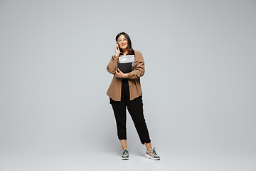 Image showing Young caucasian woman in casual wear. Bodypositive female character, plus size businesswoman