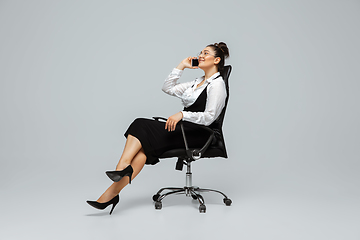 Image showing Young caucasian woman in office attire. Bodypositive female character. plus size businesswoman