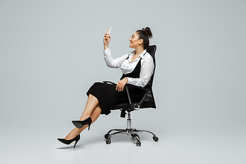 Image showing Young caucasian woman in office attire. Bodypositive female character. plus size businesswoman