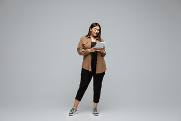 Image showing Young caucasian woman in casual wear. Bodypositive female character, plus size businesswoman