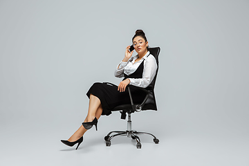 Image showing Young caucasian woman in office attire. Bodypositive female character. plus size businesswoman