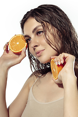 Image showing Close up of beautiful young woman over white background. Cosmetics and makeup, natural and eco treatment, skin care.