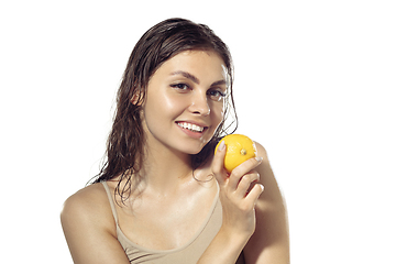 Image showing Close up of beautiful young woman over white background. Cosmetics and makeup, natural and eco treatment, skin care.