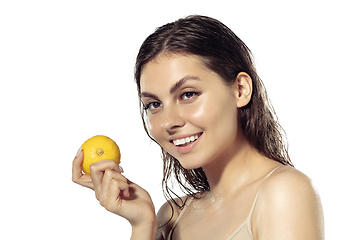 Image showing Close up of beautiful young woman over white background. Cosmetics and makeup, natural and eco treatment, skin care.