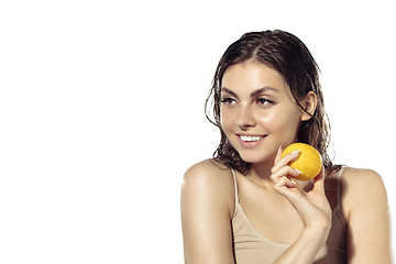 Image showing Close up of beautiful young woman over white background. Cosmetics and makeup, natural and eco treatment, skin care.