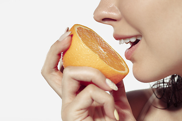 Image showing Close up of beautiful young woman over white background. Cosmetics and makeup, natural and eco treatment, skin care.