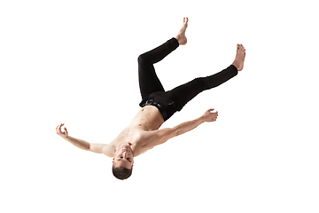 Image showing Mid-air beauty. Full length studio shot of attractive young man hovering in air and keeping eyes closed