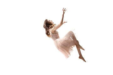 Image showing Mid-air beauty. Full length studio shot of attractive young woman hovering in air and keeping eyes closed